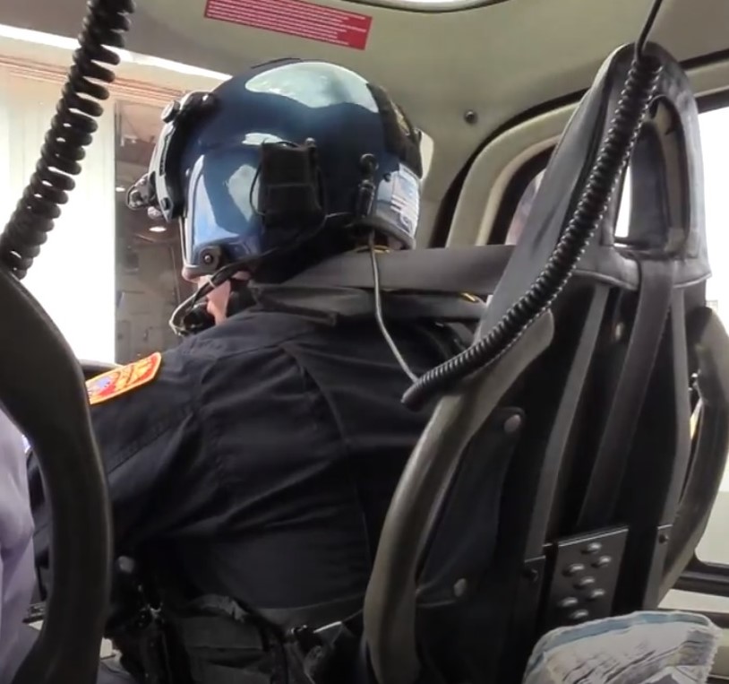 image of pilot inside of SCPD helicopter